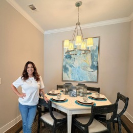 woman standing in a dining room