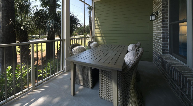 a patio with a table and chairs