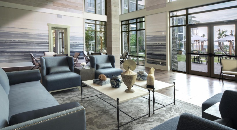 a lounge room with a large glass wall